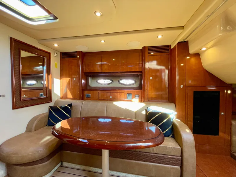 Slide: The Image of Luxurious interior of 2005 Sea Ray 390 Sundancer yacht with elegant wood finishes. - 23