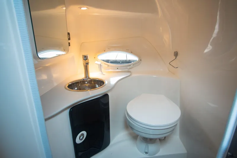 Slide: The Image of Compact bathroom in 2025 Hanover 305 Outboard boat with sink and toilet. - 15