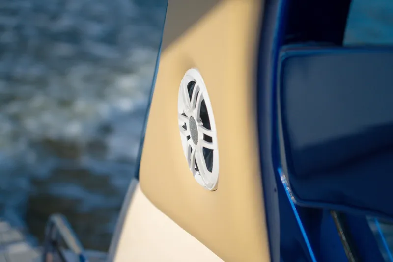 Slide: The Image of 2025 Hanover 305 Outboard boat detail with speaker, featuring sleek design and modern aesthetics. - 18