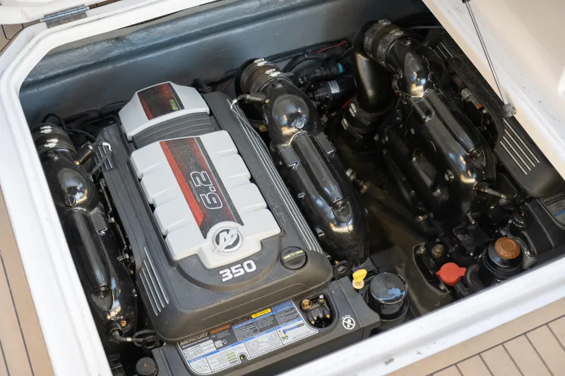 Slide: The Image of 2025 Hanover 305 Outboard engine compartment with 6.2L 350 horsepower engine. - 19