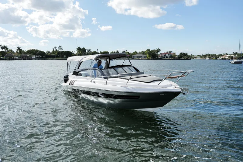 Slide: The Image of 2025 Hanover 305 Outboard boat cruising on a sunny day. - 4