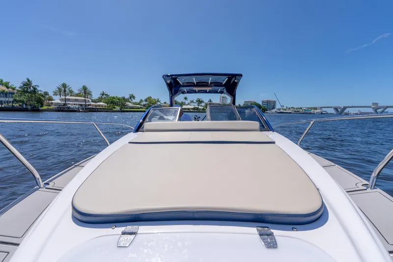 Slide: The Image of 2025 Hanover 305 Outboard boat on water, featuring spacious deck and sleek design. - 7