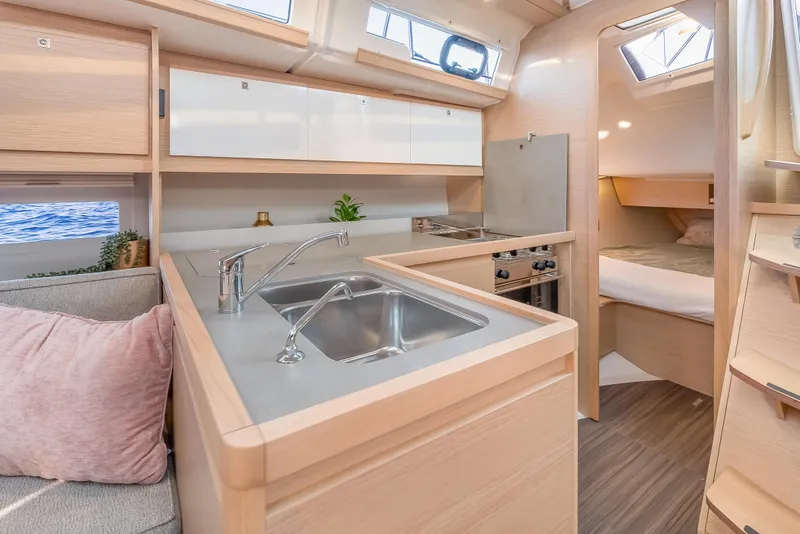 Slide: The Image of Modern kitchen interior of 2023 Dufour 390 yacht with sleek design and natural light. - 15