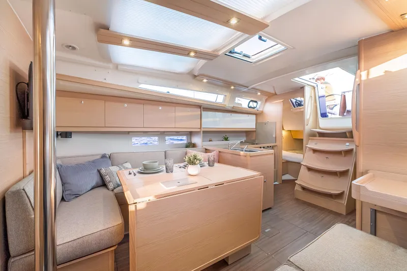 Slide: The Image of Modern interior of 2023 Dufour 390 yacht with elegant furnishings and natural light. - 20