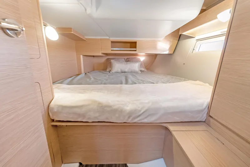 Slide: The Image of Cozy cabin interior of 2023 Dufour 390 yacht with modern wood finish. - 26