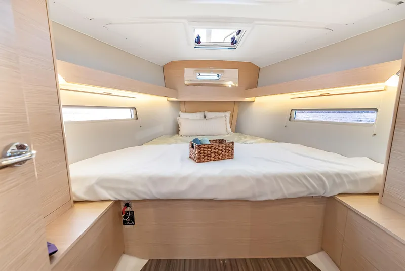 Slide: The Image of Luxurious cabin interior of 2023 Dufour 390 yacht with cozy bed and natural light. - 28