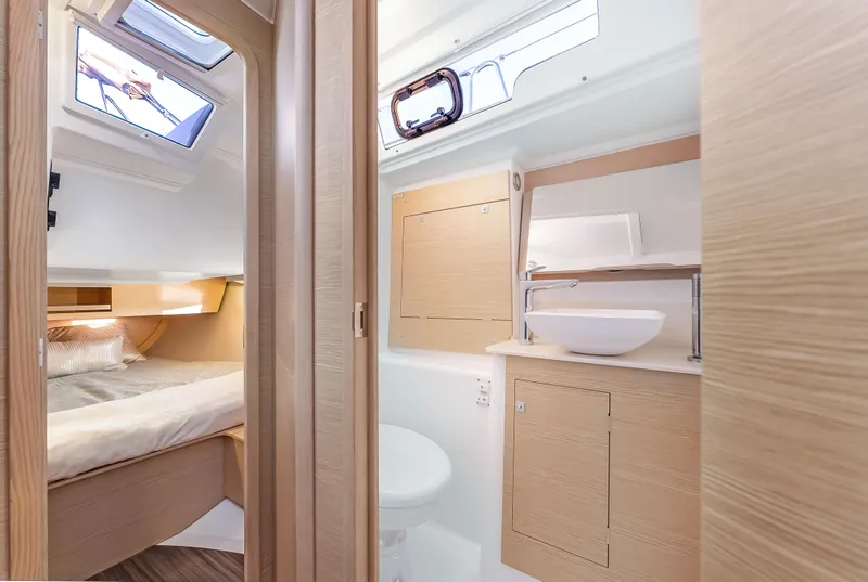 Slide: The Image of Modern interior of 2023 Dufour 390 yacht featuring bedroom and bathroom. - 29