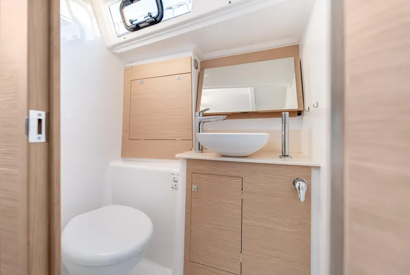 Slide: The Image of Modern bathroom in 2023 Dufour 390 yacht with sleek fixtures and wooden cabinetry. - 30