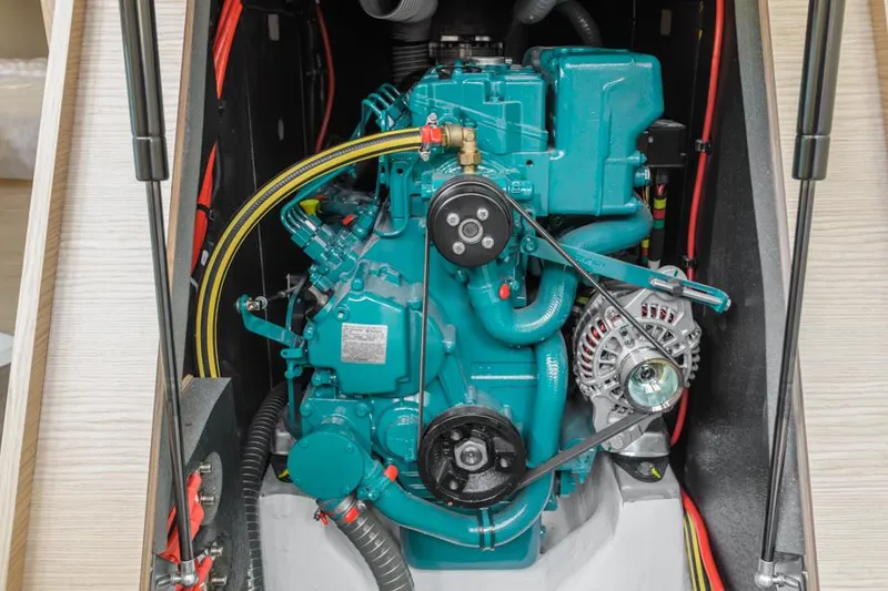 Slide: The Image of Engine compartment of 2023 Dufour 390 sailboat, showcasing a modern marine engine. - 32