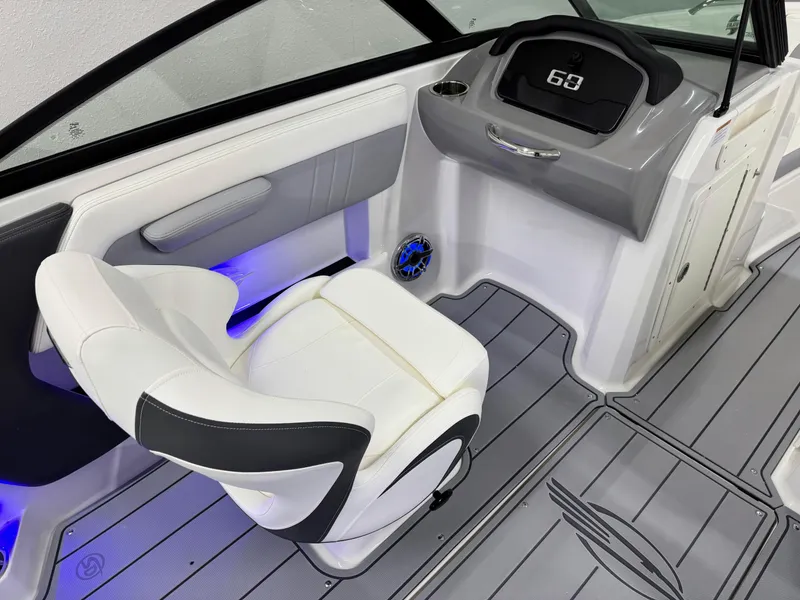 Slide: The Image of 2025 Chaparral 21 Surf boat interior with modern dashboard and seating. - 18