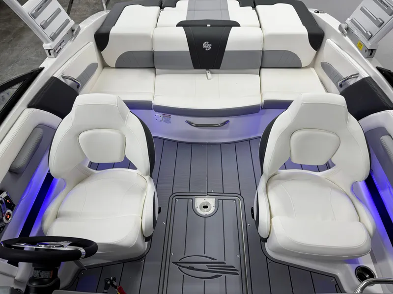 Slide: The Image of 2025 Chaparral 21 Surf boat interior with white seating and modern design. - 21