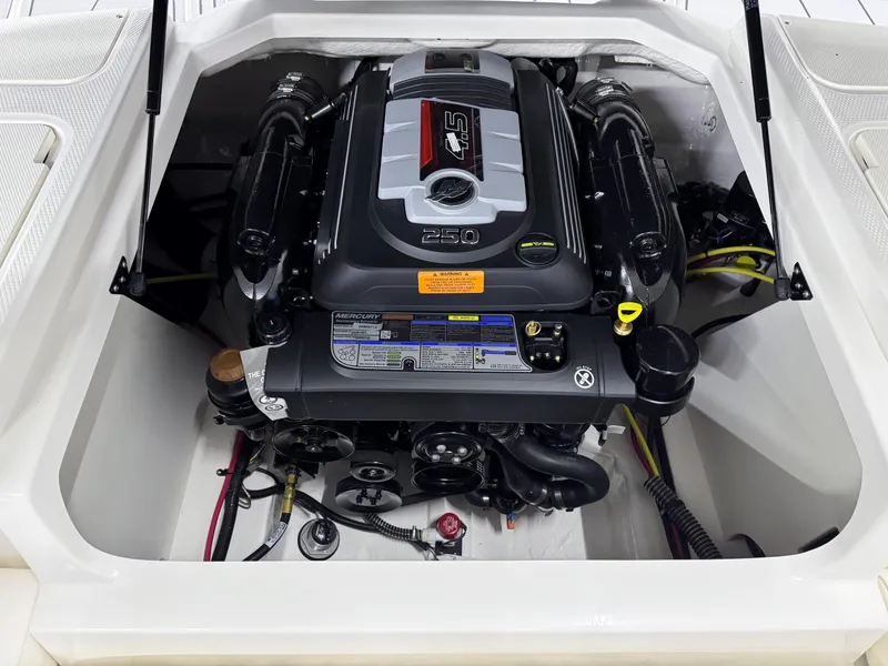 Slide: The Image of 2025 Chaparral 21 Surf boat engine compartment, showcasing powerful inboard motor. - 25