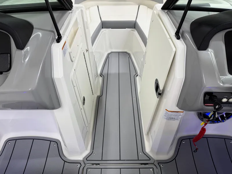 Slide: The Image of 2025 Chaparral 21 Surf boat interior with sleek gray flooring and modern design. - 29