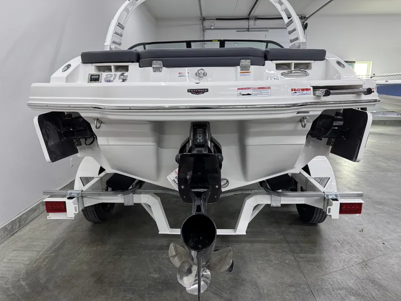 Slide: The Image of 2025 Chaparral 21 Surf boat rear view in a garage setting. - 3