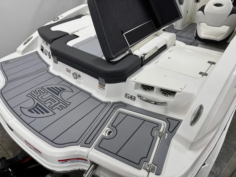 Slide: The Image of 2025 Chaparral 21 Surf boat deck with sleek design and comfortable seating. - 6