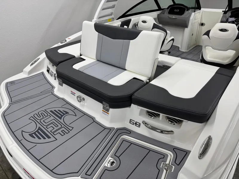 Slide: The Image of 2025 Chaparral 21 Surf boat interior with stylish seating and surf-themed flooring. - 7