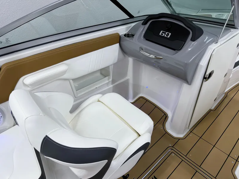 Slide: The Image of Interior of 2025 Chaparral 23 SSi boat with modern dashboard and seating. - 24