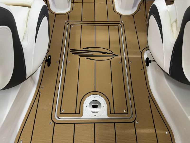 Slide: The Image of 2025 Chaparral 23 SSi boat interior with teak-style flooring and white seating. - 26