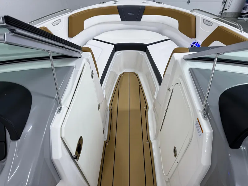 Slide: The Image of 2025 Chaparral 23 SSi boat interior with sleek design and comfortable seating. - 28