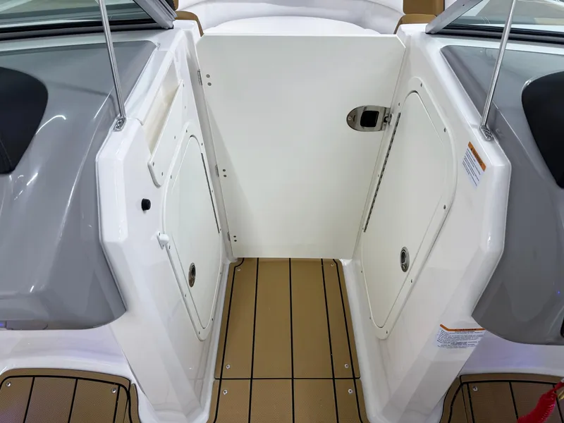 Slide: The Image of Interior view of 2025 Chaparral 23 SSi boat, featuring sleek design and storage compartments. - 29