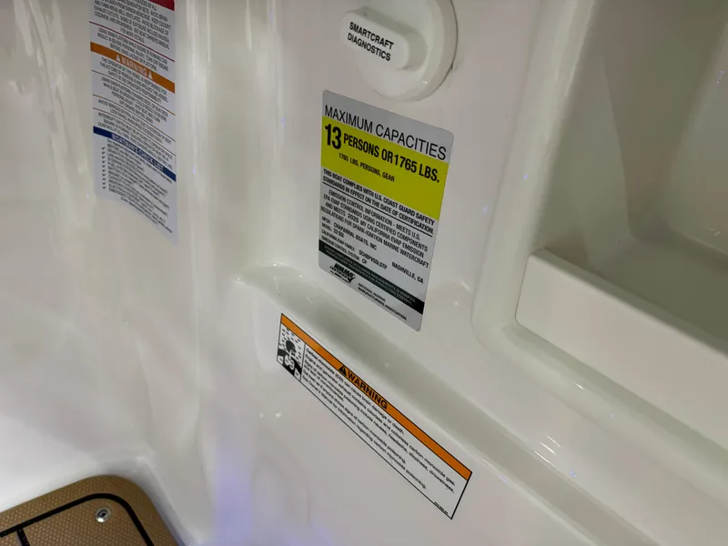 Slide: The Image of 2025 Chaparral 23 SSi boat capacity label, maximum 13 persons or 1,765 lbs. - 34