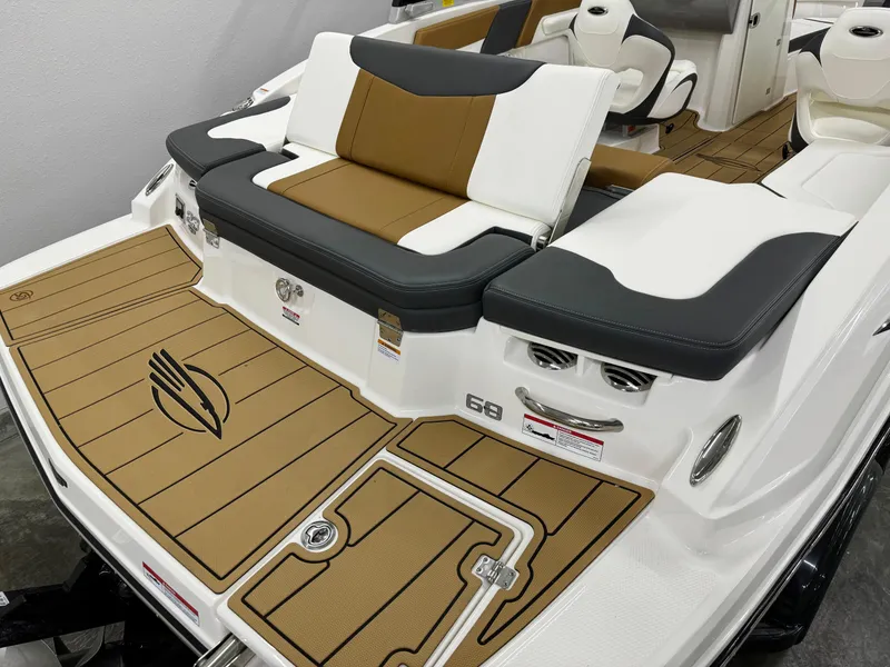 Slide: The Image of 2025 Chaparral 23 SSi boat with stylish seating and teak-style flooring. - 6