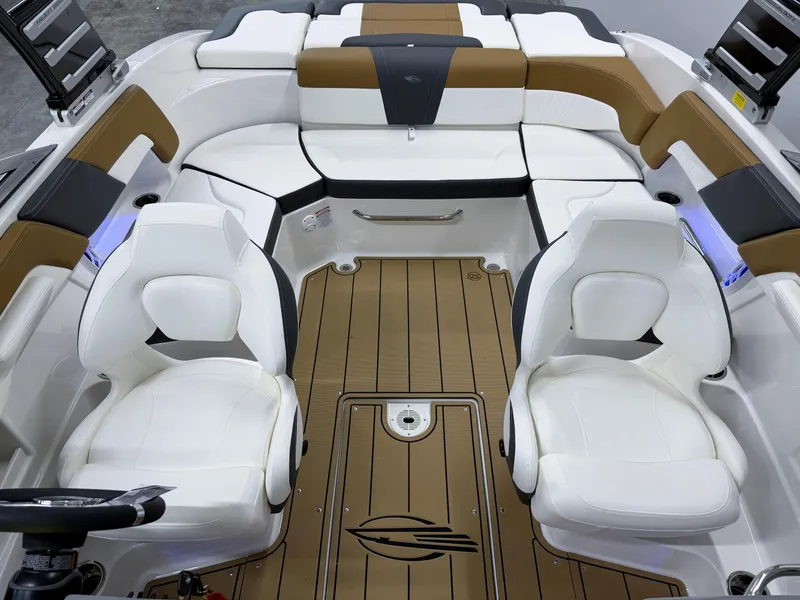 Slide: The Image of Interior of 2025 Chaparral 23 SSi boat with white and brown seating. - 9