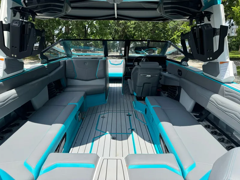 Slide: The Image of 2025 Nautique G25 boat interior with spacious seating and modern design. - 22