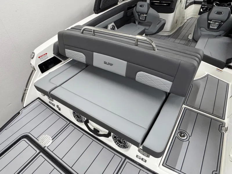 Slide: The Image of 2025 Chaparral 26 Surf boat interior with gray seating and modern design. - 12