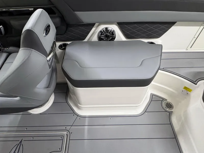 Slide: The Image of 2025 Chaparral 26 Surf boat interior with gray seating and modern design. - 26