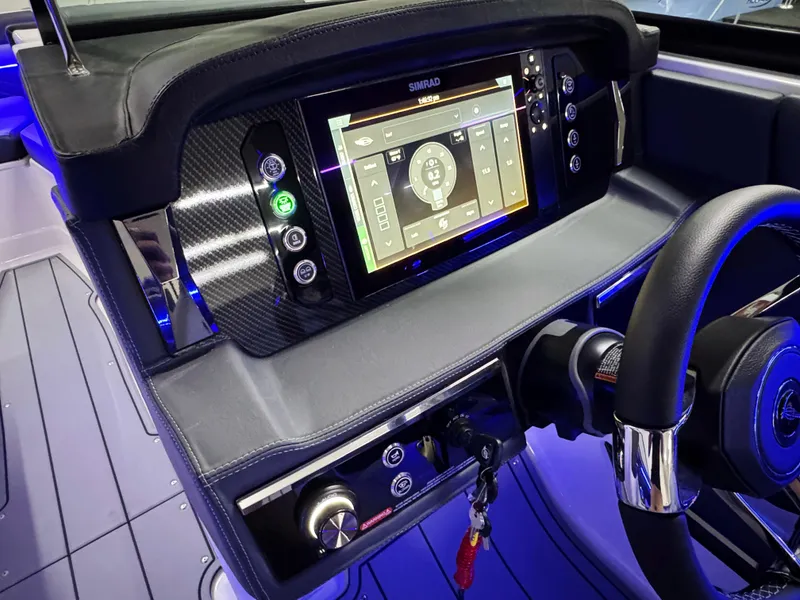 Slide: The Image of 2025 Chaparral 26 Surf dashboard with advanced navigation system and sleek design. - 39