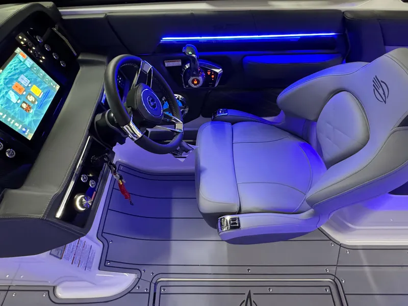 Slide: The Image of Interior of 2025 Chaparral 26 Surf boat with modern dashboard and illuminated seating. - 42