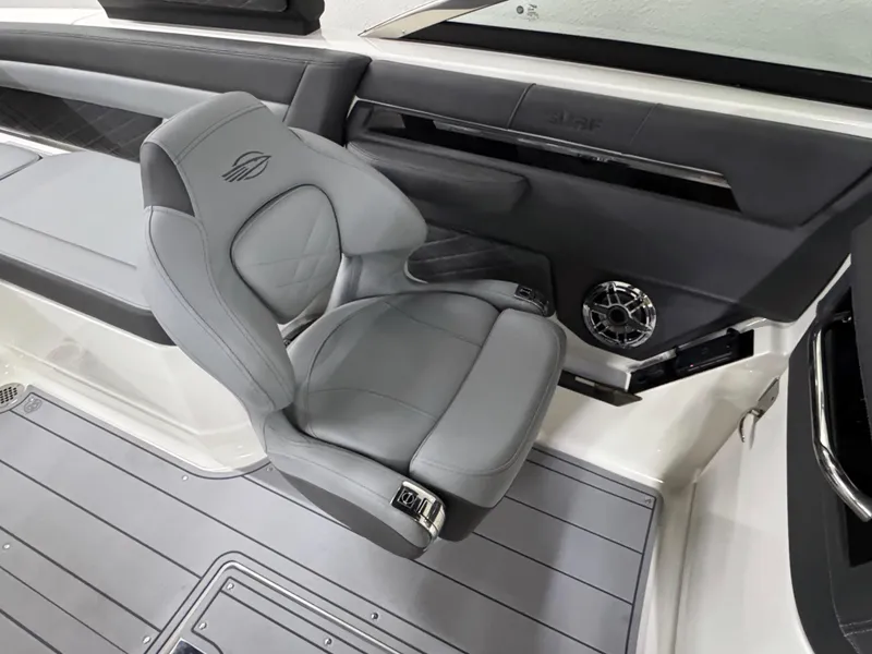 Slide: The Image of 2025 Chaparral 26 Surf boat interior with sleek gray seating and modern design. - 48