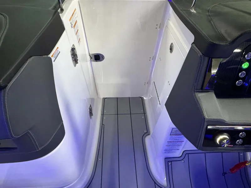 Slide: The Image of Interior view of 2025 Chaparral 26 Surf boat with sleek seating and modern controls. - 53