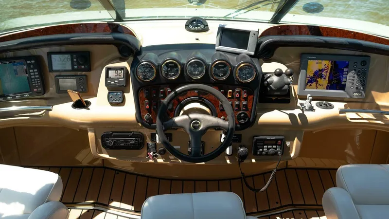 Slide: The Image of Dashboard of a 2004 Carver 466 Motor Yacht with navigation instruments and controls. - 10