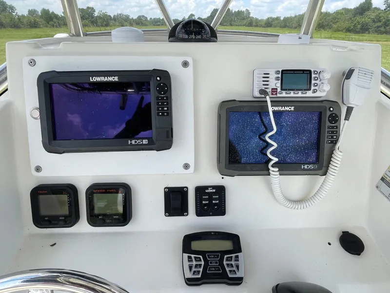 Slide: The Image of 2008 Pursuit 230 Center Console dashboard with navigation and communication equipment. - 15