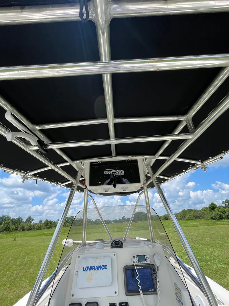 Slide: The Image of 2008 Pursuit 230 Center Console boat with T-top and navigation equipment. - 18