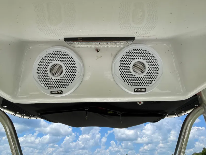 Slide: The Image of Speakers on 2008 Pursuit 230 Center Console boat against a cloudy sky. - 19