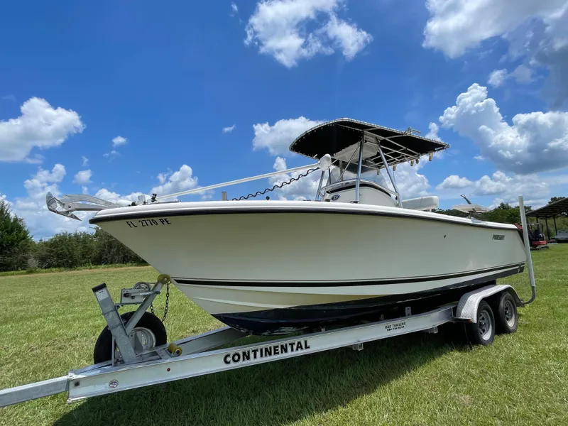 Slide: The Image of 2008 Pursuit 230 Center Console boat on trailer under blue sky. - 2