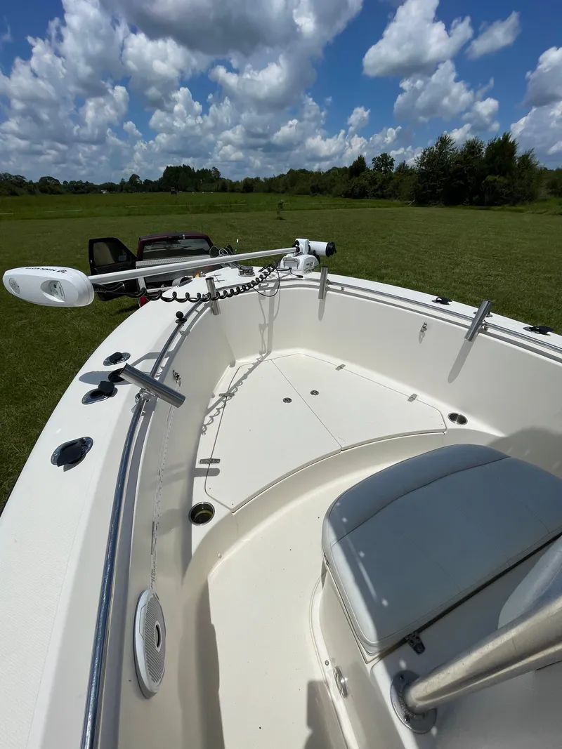 Slide: The Image of 2008 Pursuit 230 Center Console boat on grassy field under cloudy sky. - 23