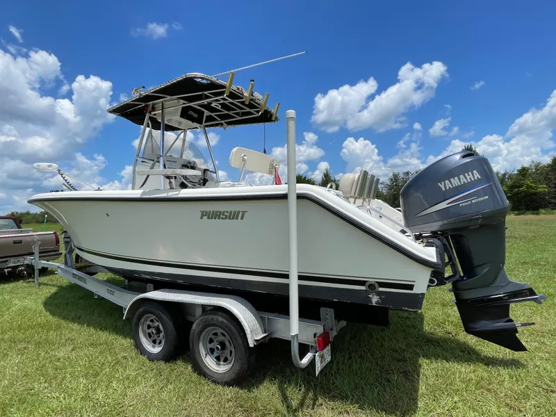Slide: The Image of 2008 Pursuit 230 Center Console boat on trailer with Yamaha outboard motor. - 3