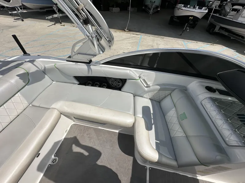 Slide: The Image of 2014 MasterCraft X2 boat interior with white leather seating and modern design. - 16