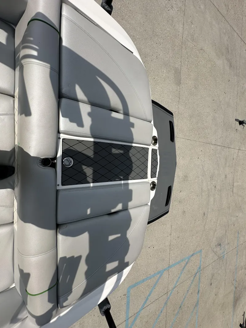 Slide: The Image of 2014 MasterCraft X2 boat interior with gray seating and black accents. - 20