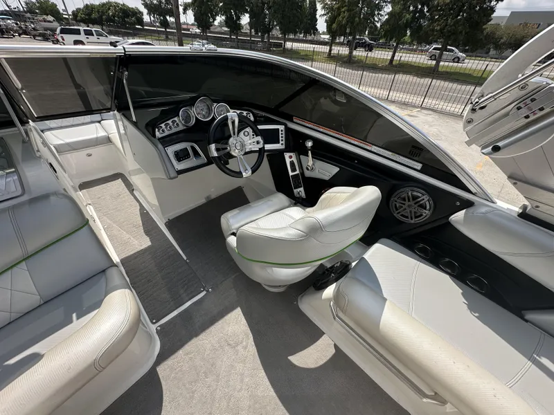 Slide: The Image of 2014 MasterCraft X2 boat interior with sleek dashboard and comfortable seating. - 21