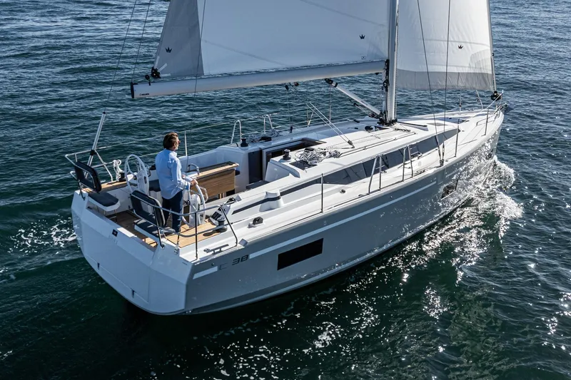 Slide: The Image of 2024 Bavaria C38 sailboat cruising on open water, featuring sleek design and modern amenities. - 14