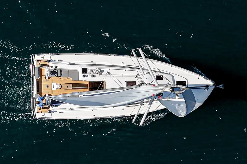 Slide: The Image of Aerial view of 2024 Bavaria C38 sailboat cruising on open water. - 16