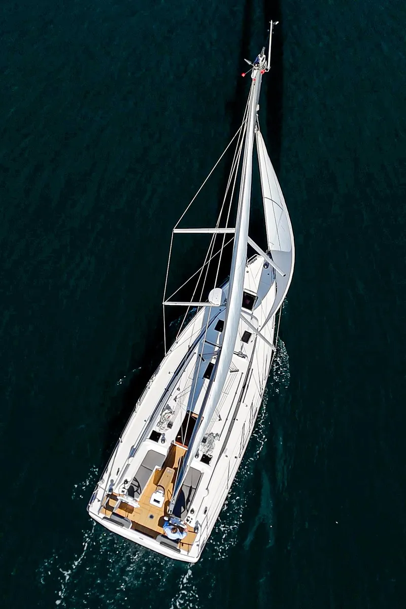 Slide: The Image of Aerial view of 2024 Bavaria C38 sailboat navigating through deep blue waters. - 17