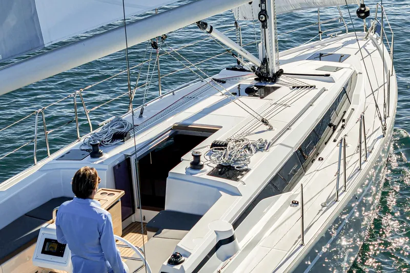 Slide: The Image of 2024 Bavaria C38 yacht sailing on open water, featuring sleek design and modern amenities. - 18
