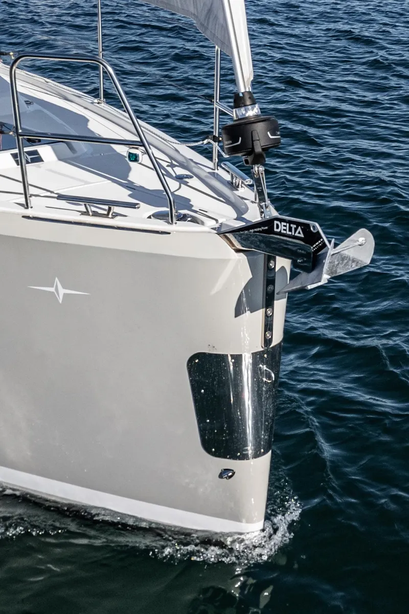 Slide: The Image of 2024 Bavaria C38 sailboat bow with Delta anchor on the water. - 21
