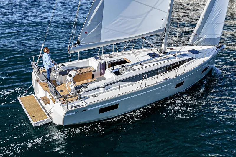 Slide: The Image of 2024 Bavaria C38 sailing yacht cruising on open water, showcasing sleek design and spacious deck. - 27